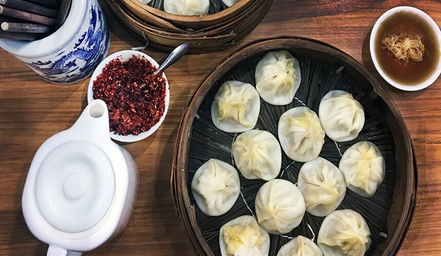 A popular local eatery known for freshly made xiaolongbao (soup dumplings), often with long lines and authentic flavors.