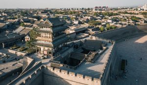 Traditional Ming-Qing style buildings along a cobbled street in Pingyao Ancient City