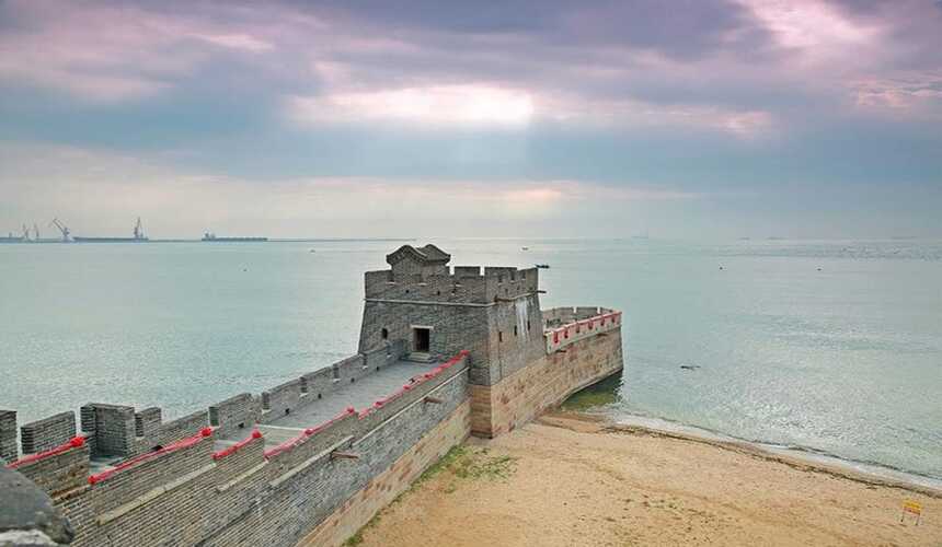 Shanhaiguan Great Wall meeting the sea in Qinhuangdao at sunset