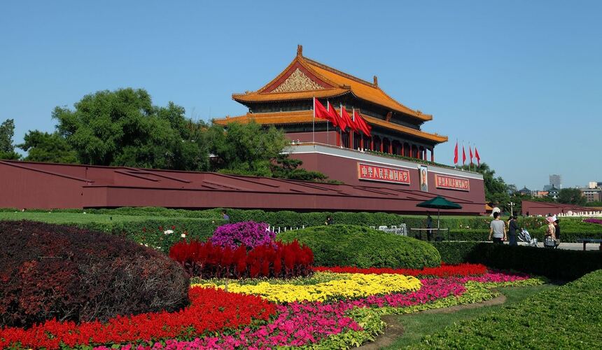 Wide-angle shot of Tiananmen Square with the Monument to the People's Heroes and nearby landmarks.