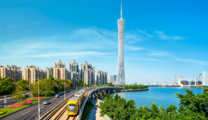 Modern skyline of Guangzhou featuring the Canton Tower and Pearl River at dusk