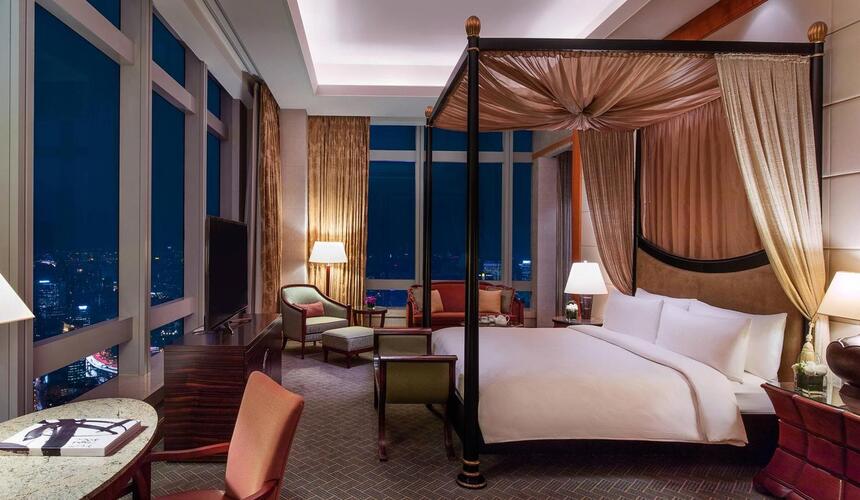 JW Marriott Hotel in Shanghai with panoramic city views from a high-rise building.