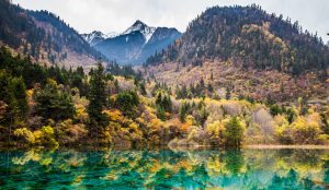 Colorful alpine lakes and multi-tiered waterfalls in Jiuzhaigou Valley, Sichuan Province, during autumn