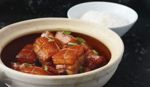 Rich and glossy hong shao rou (Shanghai-style braised pork belly) served with rice.