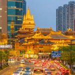 Iconic view of Shanghai skyline featuring Oriental Pearl Tower and modern cityscape.
