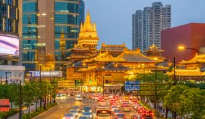 Iconic view of Shanghai skyline featuring Oriental Pearl Tower and modern cityscape.