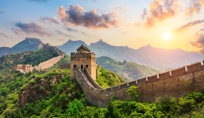 Panoramic view of the Great Wall of China stretching across rugged mountain ridges