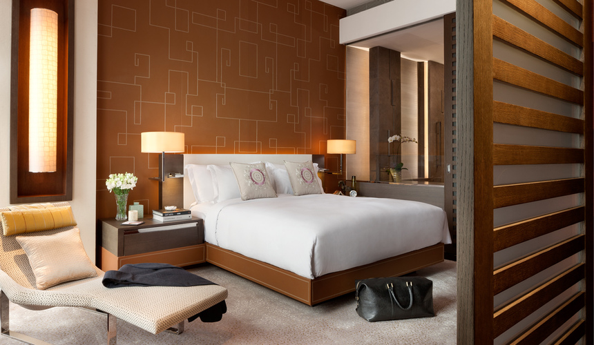 Elegant lobby of The Langham Shanghai hotel with luxurious furnishings and chandeliers.