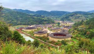 Aerial view of circular earth buildings known as Tulou, traditional Hakka homes in Fujian Province.