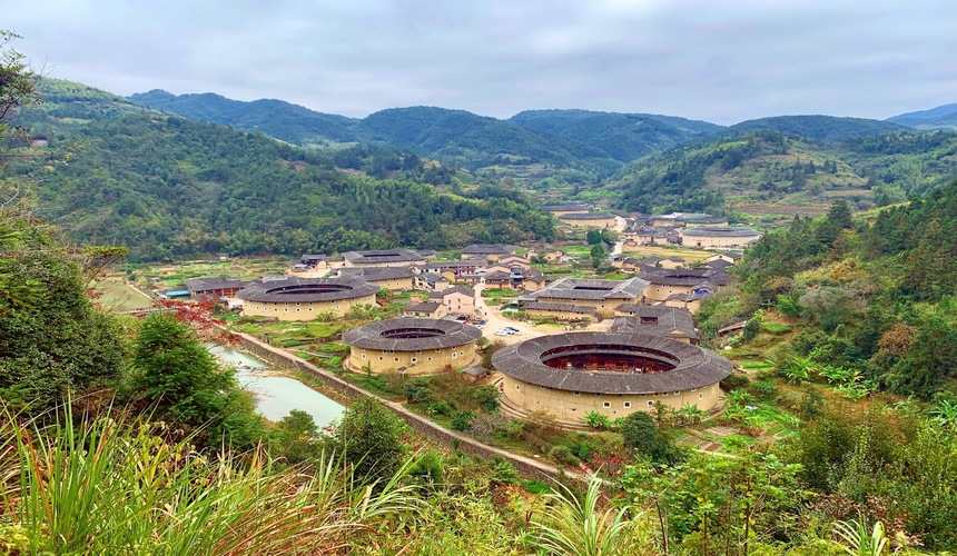 Aerial view of circular earth buildings known as Tulou, traditional Hakka homes in Fujian Province.