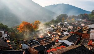 Charming traditional houses and yellow rapeseed flowers in Wuyuan Village, Jiangxi Province