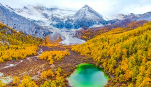 Snow-capped sacred peaks and crystal-clear lakes in Yading Nature Reserve, Sichuan Province