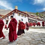 Cultural and natural wonders across Tibet, China, including temples, mountains, and prayer flags.
