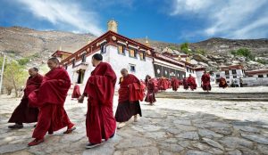 Cultural and natural wonders across Tibet, China, including temples, mountains, and prayer flags.