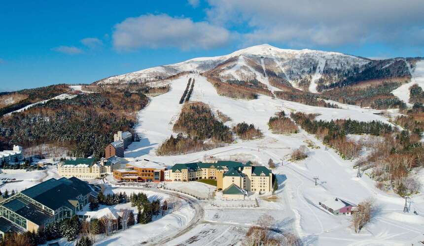 Ski lifts and snowy mountains at Beidahu Ski Resort in China