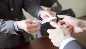 Formal handshake in meeting room reflecting business etiquette in China