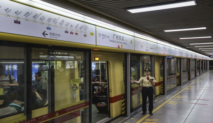 Interior view of Guangzhou Metro train with passengers during commute
