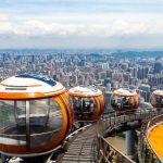 Panoramic city view of Guangzhou, China, featuring modern skyscrapers and the Pearl River