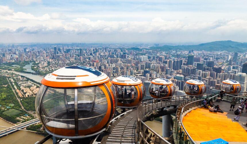 Panoramic city view of Guangzhou, China, featuring modern skyscrapers and the Pearl River