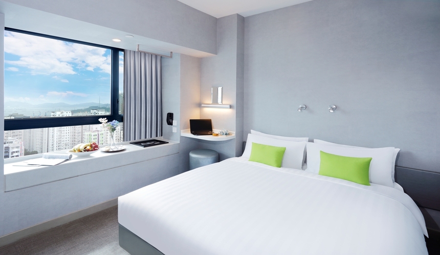 Modern guest room interior at Hotel Ease Mong Kok in Hong Kong. 