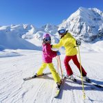 Tourists skiing on snowy slopes at a ski resort in China