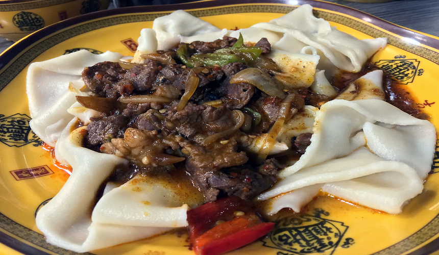 Hand-pulled Biangbiang noodles served with spicy sauce in Xi’an