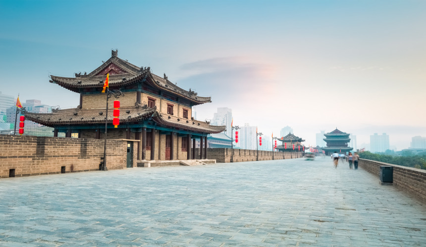 Panoramic view of Xi’an City Wall with traditional watchtowers and red lanterns