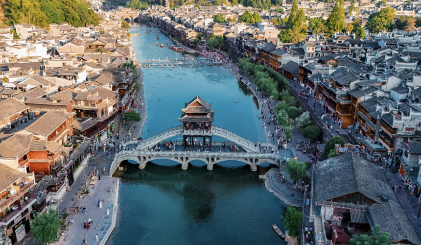 Night view of Fenghuang Ancient Town with riverside lanterns