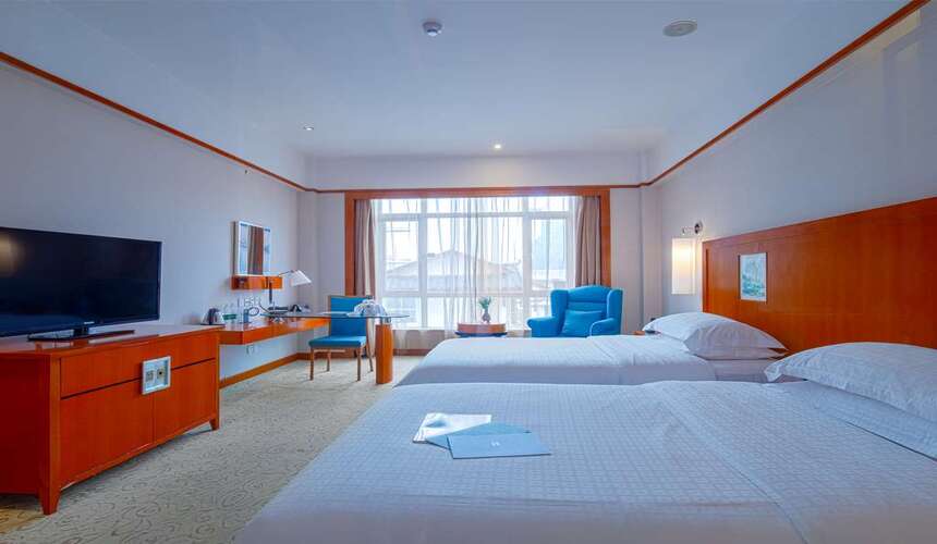 Luxury Pullman Zhangjiajie Hotel exterior surrounded by mountains