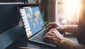 Traveler using laptop to book the flight ticket online