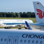 Airplane flying over Beijing skyline representing cheap flights to China