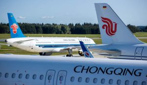 Airplane flying over Beijing skyline representing cheap flights to China