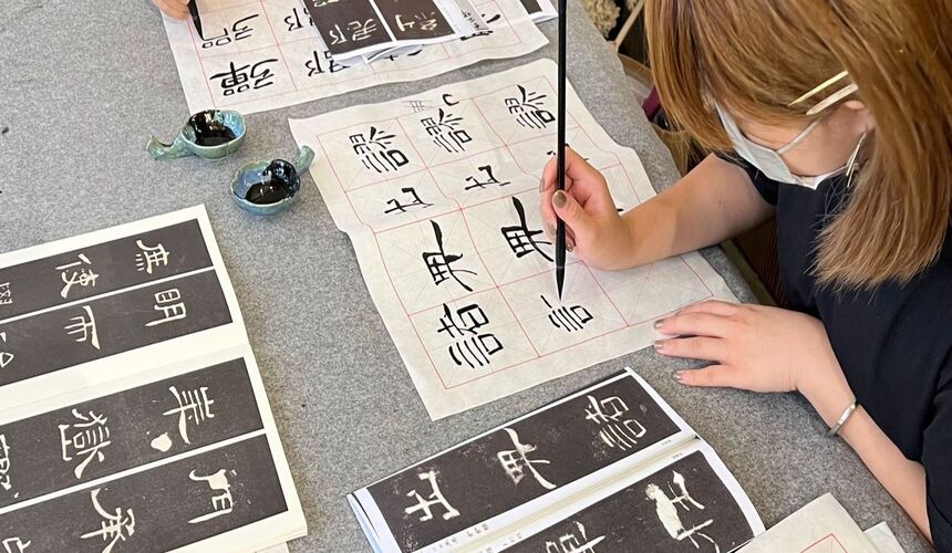 Chinese calligraphy classes teaching brush techniques and artistic writing styles.