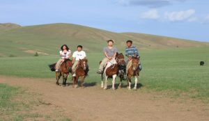 Horse riding adventure in Inner Mongolia across vast grasslands and scenic landscapes.