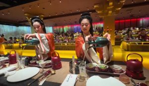 Experience traditional Chinese clothing and cuisine with cultural dress-up and authentic dishes.