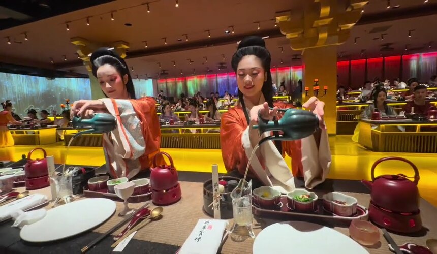 Experience traditional Chinese clothing and cuisine with cultural dress-up and authentic dishes.