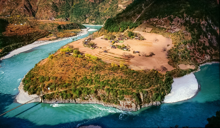 Remote Tibetan region with dramatic river gorges and snow-capped mountains.