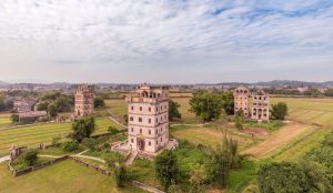 Historic multi-story watchtowers blending Chinese and Western architectural styles.
