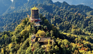 Misty Taoist mountain surrounded by ancient temples and dense forest trails.