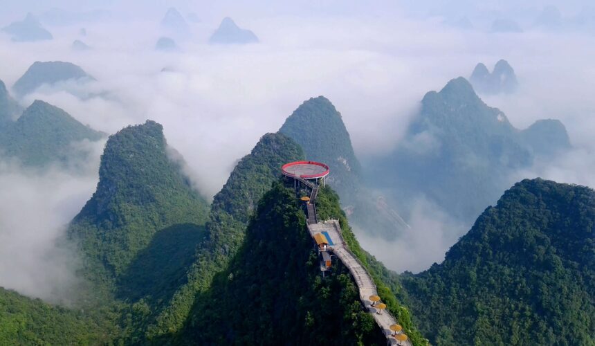Panoramic view of Ruyi Peak with its curved bridge and lush mountain scenery.