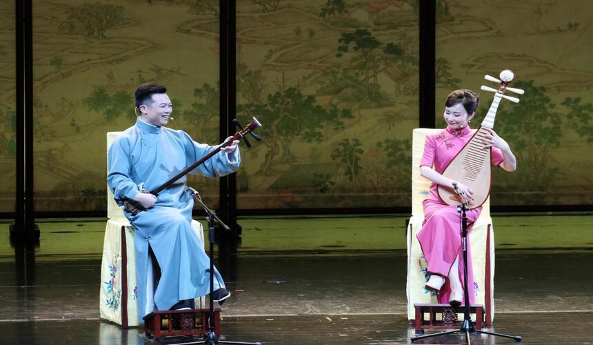Pingtan storytelling performance in Suzhou with musicians narrating traditional tales using string instruments.