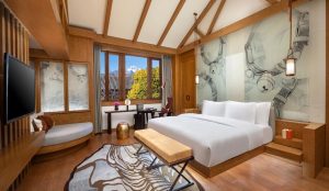 Hotel Indigo Lijiang Ancient Town with traditional design and mountain backdrop