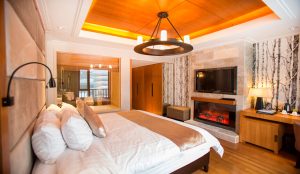 Snow-covered Club Med Yabuli ski resort with alpine slopes and winter forest scenery near Harbin, China.