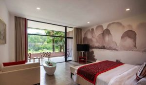 Scenic view of Club Med Guilin resort surrounded by dramatic karst mountains and lush greenery in Guangxi, China.