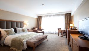 Modern Club Med Beidahu ski resort set among snowy mountains and ski runs in Jilin, China.