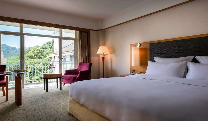 Exterior view of Pullman Zhangjiajie Hotel set against dramatic mountain scenery