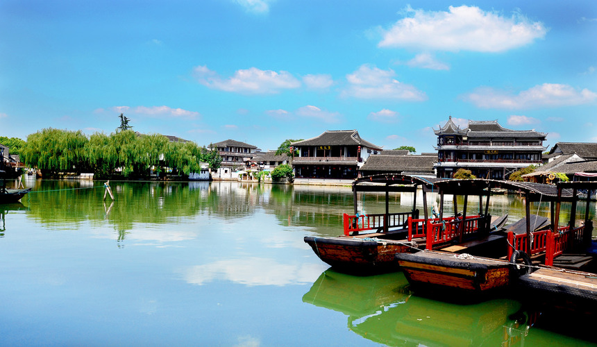 Quiet waterways, ancient bridges, and lakeside views in Jinxi water town.