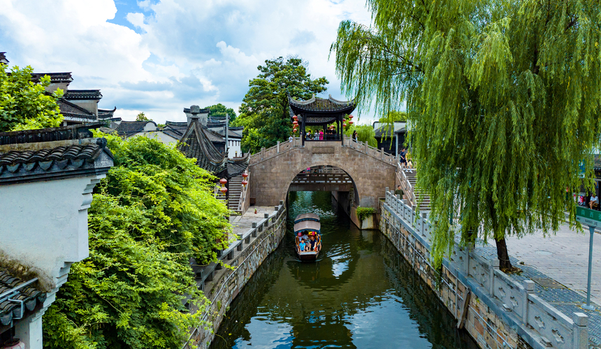 Elegant mansions, European-influenced architecture, and tranquil canals in Nanxun water town.