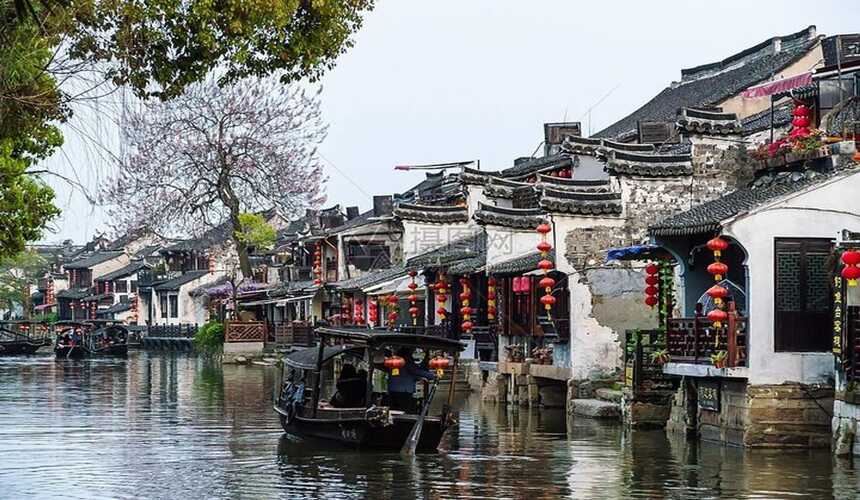 Well-preserved wooden buildings, stone streets, and canals in Wuzhen water town.