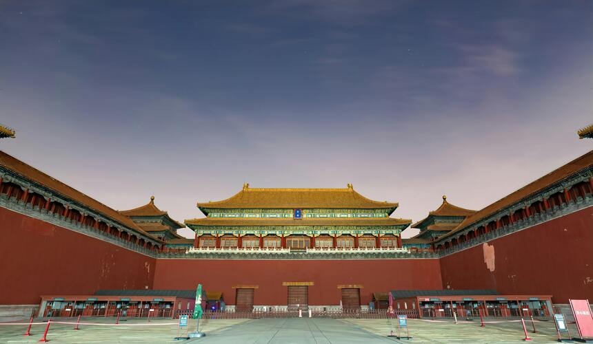 The Meridian Gate entrance of the Forbidden City with towering red walls, arched gateways, and traditional yellow roof tiles.